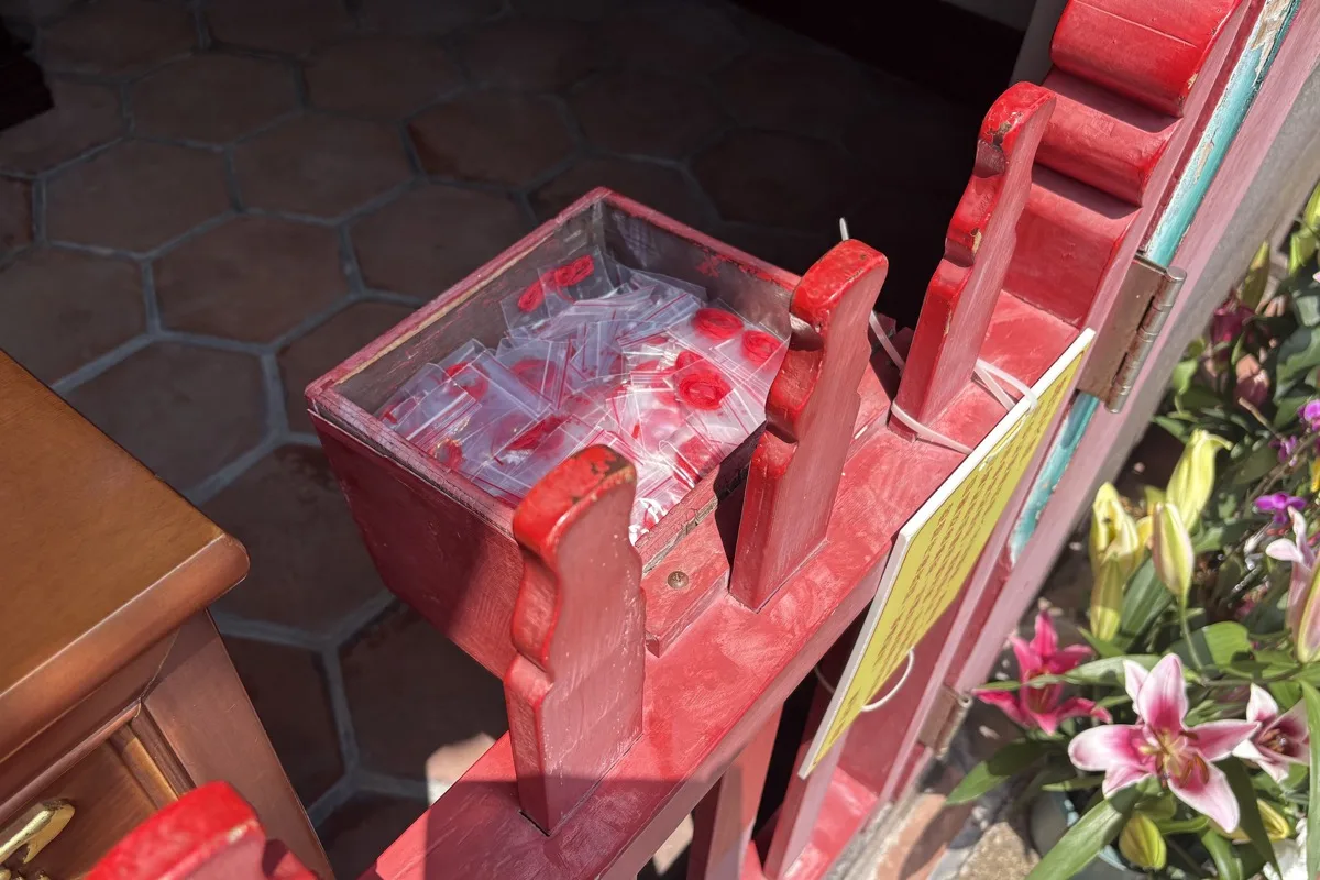 Small coils of red thread offered at the Yue Lao hall of Longshan Temple