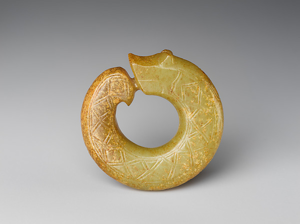 Nephrite pendant carved as a coiling dragon